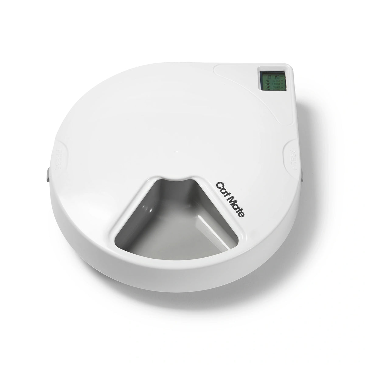 Top view of a white Cat Mate automatic pet feeder with a circular design. The feeder has a digital display screen in the top right corner and a visible feeding compartment at the front. The Cat Mate logo is printed near the food opening, and there are 'PRESS' buttons on both sides for lid release.