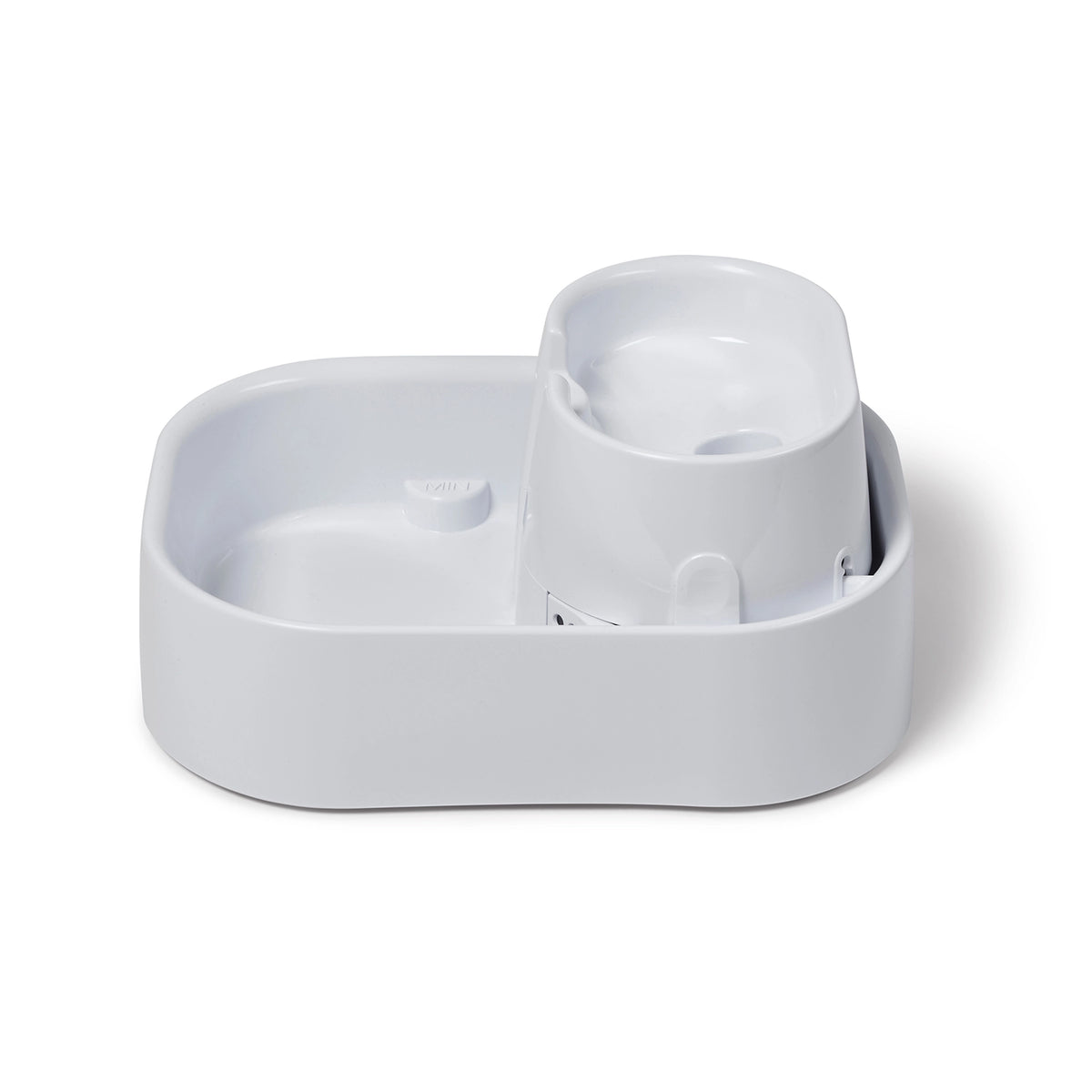 Side view of a white pet drinking fountain on a white background