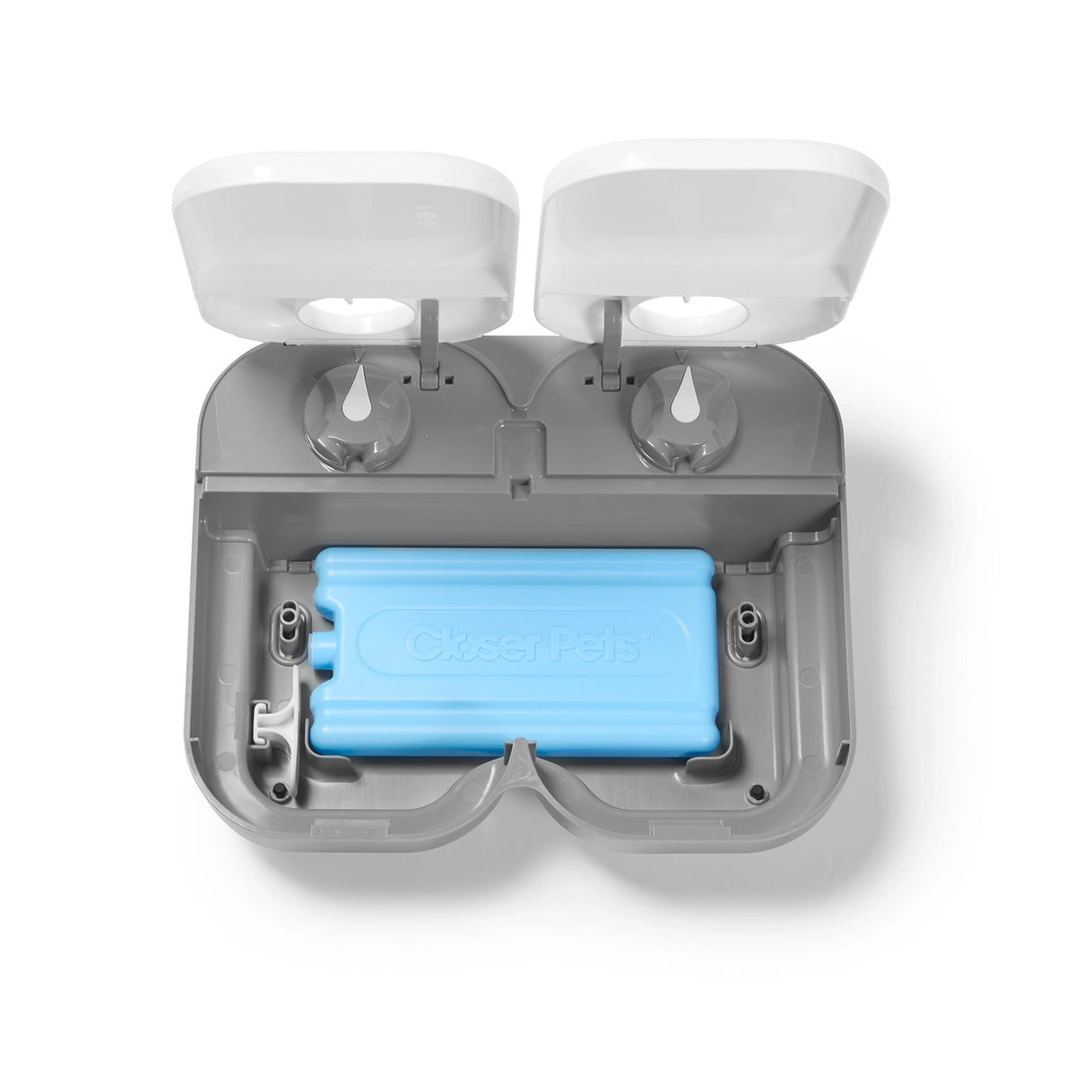 Top view of a grey and white two meal pet feeder with a blue battery inside on a white background