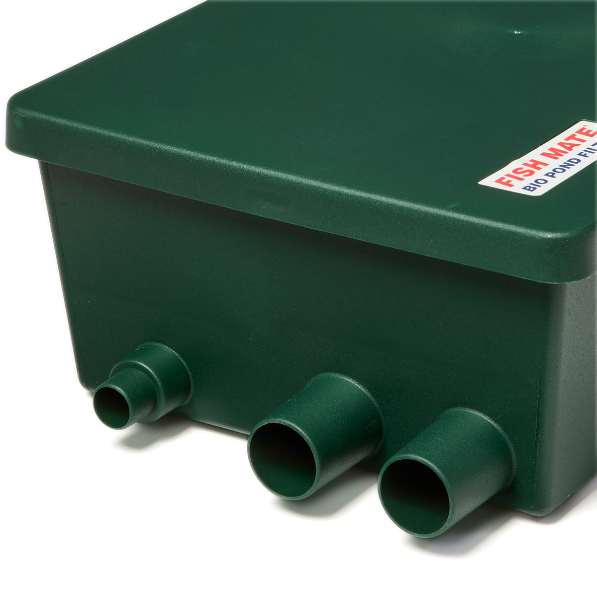 A close view of Green rectangular filter with three pipes protruding out on a white background