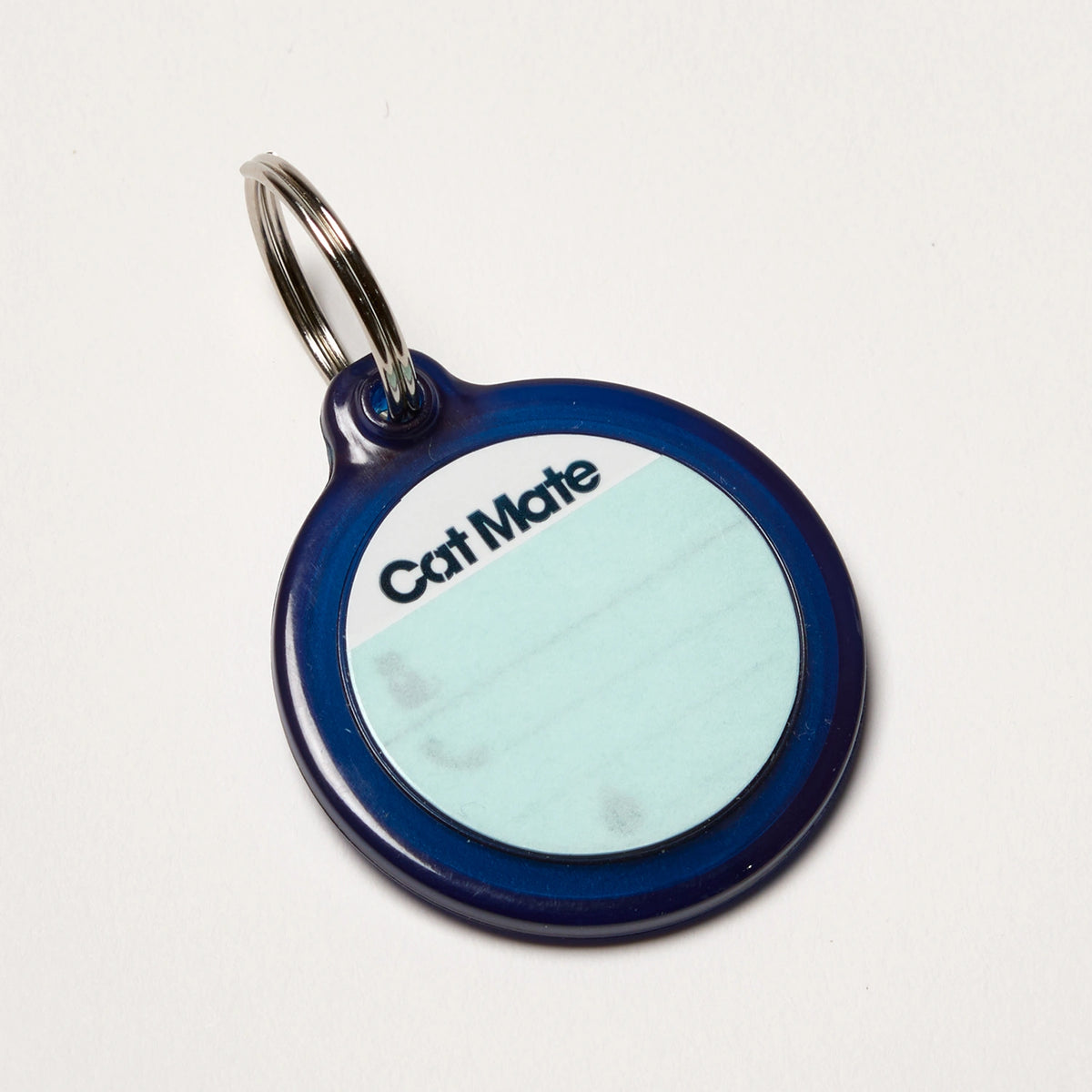 Cat Mate pet tag on a white background