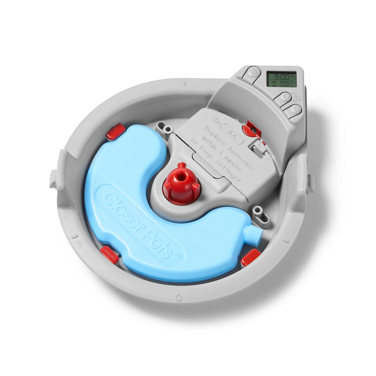 A detailed view of the inside of the automatic pet feeder which includes an ice pack to keep the food chilled. 