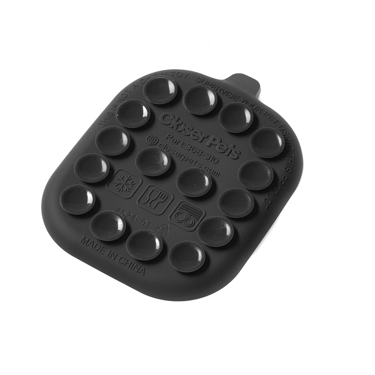 Underside view of a black silicone mat with multiple round cavities on a white background