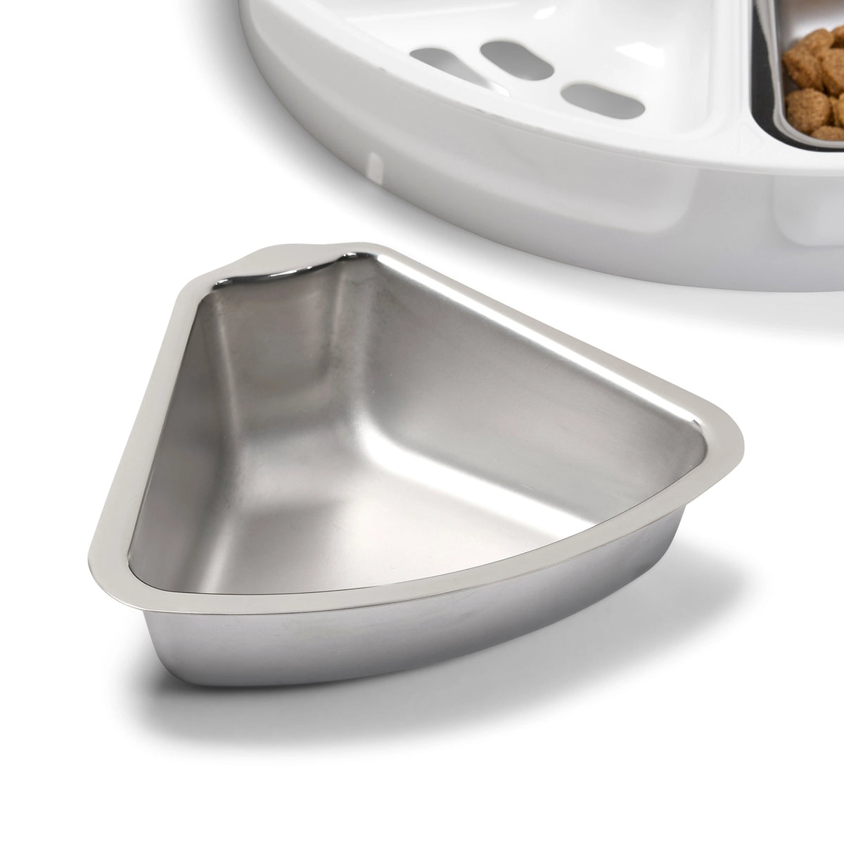 Stainless steel pet food bowl on a white background